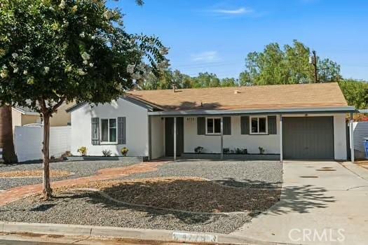 4775 Beverly Ct, Riverside, CA 92506 - single story home with concrete driveway, a garage, and stucco siding