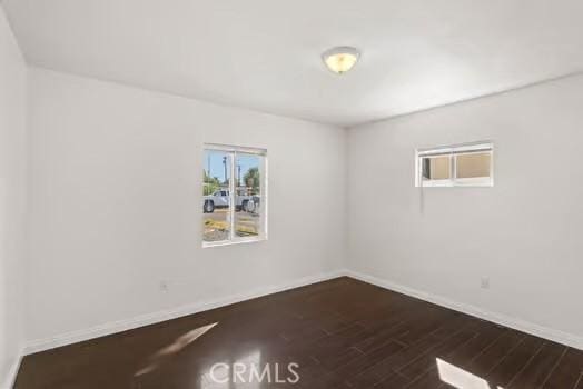 4775 Beverly Ct, Riverside, CA 92506 - empty room featuring baseboards and dark wood-style floors