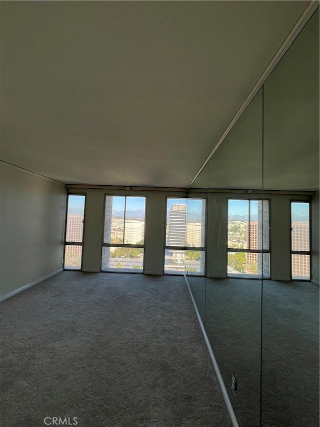 800 W 1st St Unit 2002, Los Angeles, CA 90012 - empty room with dark carpet and healthy amount of natural light