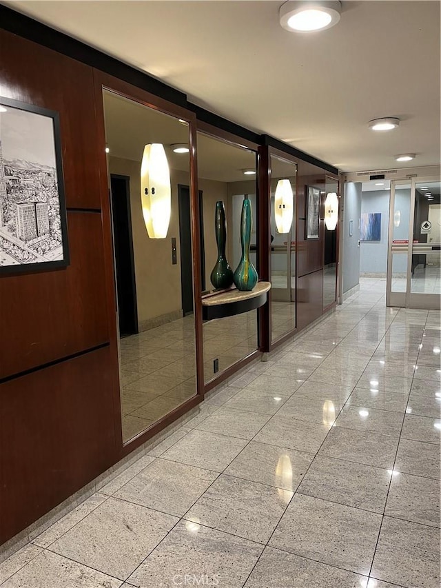 800 W 1st St Unit 2002, Los Angeles, CA 90012 - corridor with baseboards and granite tiled floors