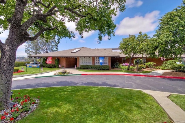 6229 Caminito Basilio, San Diego, CA 92111 - ranch-style home featuring a front lawn, a garage, brick siding, and driveway