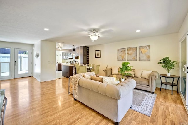 6229 Caminito Basilio, San Diego, CA 92111 - living room featuring a ceiling fan, light wood finished floors, recessed lighting, and a chandelier