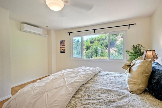 6229 Caminito Basilio, San Diego, CA 92111 - bedroom featuring a wall mounted AC and wood finished floors