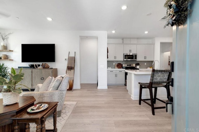 2051 Julie Dawn Pl, Escondido, CA 92026 - living area featuring light wood-style flooring and recessed lighting