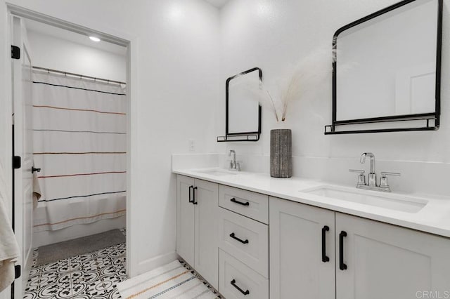 2051 Julie Dawn Pl, Escondido, CA 92026 - full bathroom with double vanity and baseboards