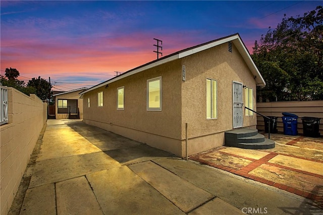 1435 E Colon St, Wilmington, CA 90744 - property exterior at dusk featuring stucco siding and a patio