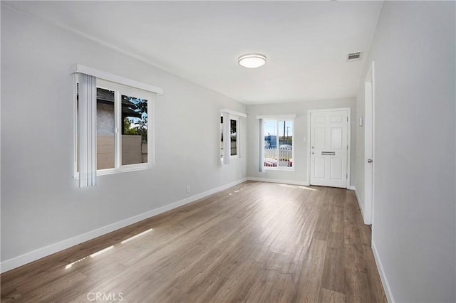 1435 E Colon St, Wilmington, CA 90744 - empty room with wood finished floors and baseboards