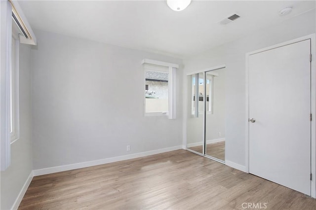 1435 E Colon St, Wilmington, CA 90744 - unfurnished bedroom with light wood-style flooring and a closet