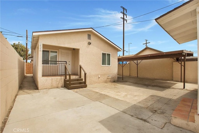 1435 E Colon St, Wilmington, CA 90744 - rear view of house featuring stucco siding