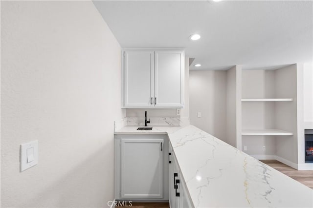 43441 30th St W Unit 3, Lancaster, CA 93536 - indoor wet bar with recessed lighting, light wood-type flooring, and built in shelves