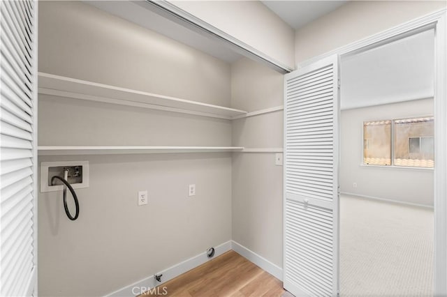 43441 30th St W Unit 3, Lancaster, CA 93536 - laundry area featuring washer hookup and wood finished floors