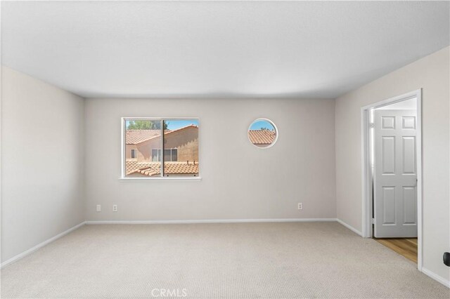 43441 30th St W Unit 3, Lancaster, CA 93536 - unfurnished room with light colored carpet and baseboards