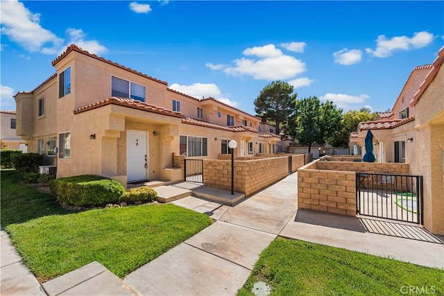 43441 30th St W Unit 3, Lancaster, CA 93536 - view of front facade featuring stucco siding, a tile roof, and a residential view
