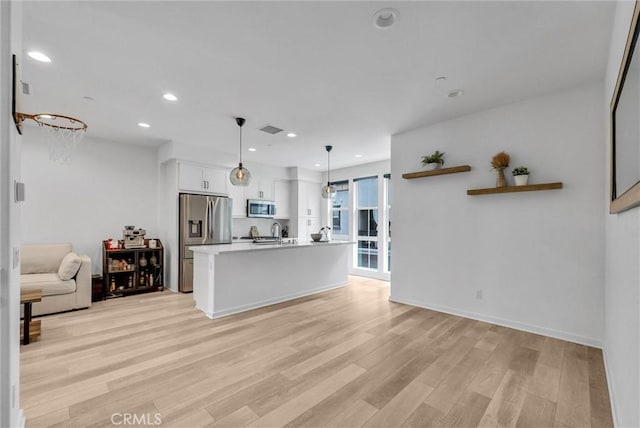 791 S Mosaic St, Anaheim, CA 92805 - kitchen with stainless steel appliances, light wood-style floors, white cabinetry, light countertops, and recessed lighting