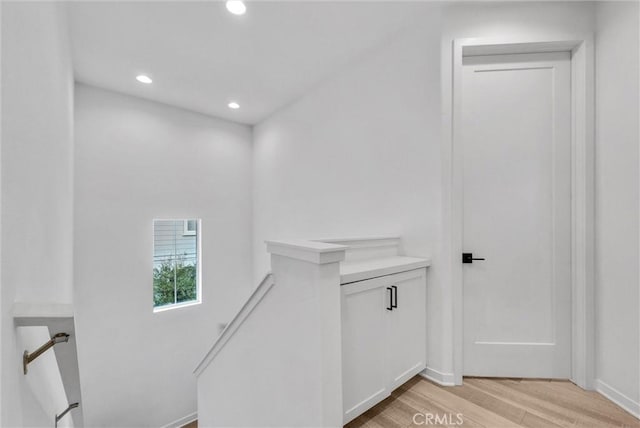 791 S Mosaic St, Anaheim, CA 92805 - corridor with an upstairs landing, light wood-type flooring, and recessed lighting