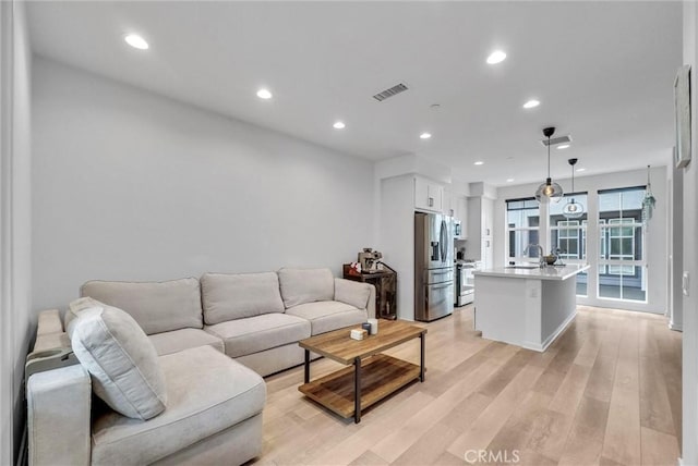 791 S Mosaic St, Anaheim, CA 92805 - living area with light wood-type flooring and recessed lighting