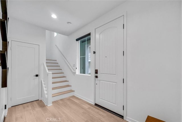 791 S Mosaic St, Anaheim, CA 92805 - foyer entrance featuring light wood finished floors, stairs, and recessed lighting
