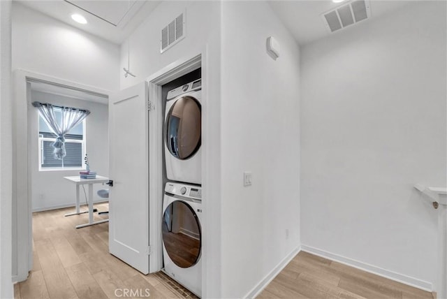 791 S Mosaic St, Anaheim, CA 92805 - laundry room featuring stacked washing machine and dryer, light wood-type flooring, and recessed lighting