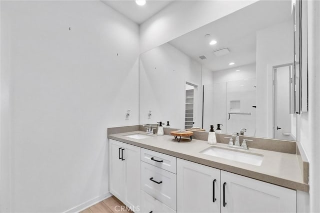 791 S Mosaic St, Anaheim, CA 92805 - bathroom with double vanity, a shower stall, and recessed lighting
