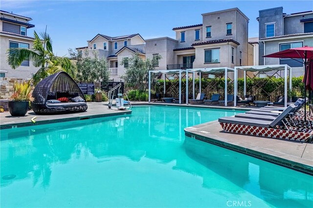 791 S Mosaic St, Anaheim, CA 92805 - community pool featuring a pergola, a residential view, and a patio