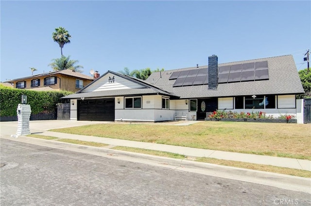 1523 Finegrove Ave, Hacienda Heights, CA 91745 - view of front of property with solar panels, concrete driveway, a chimney, an attached garage, and roof with shingles