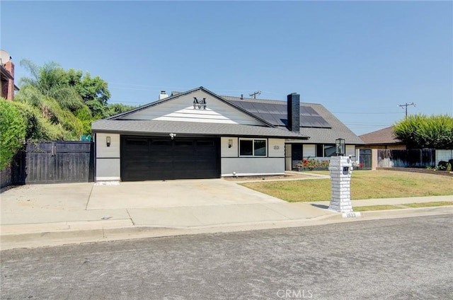1523 Finegrove Ave, Hacienda Heights, CA 91745 - ranch-style home featuring roof mounted solar panels, an attached garage, and concrete driveway