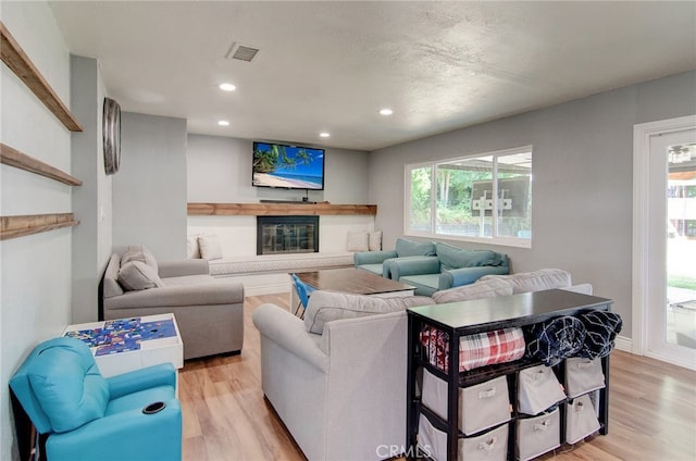 1523 Finegrove Ave, Hacienda Heights, CA 91745 - living area featuring a glass covered fireplace, light wood-type flooring, plenty of natural light, and recessed lighting