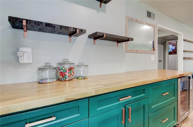 1523 Finegrove Ave, Hacienda Heights, CA 91745 - kitchen with open shelves, butcher block counters, wine cooler, and green cabinetry