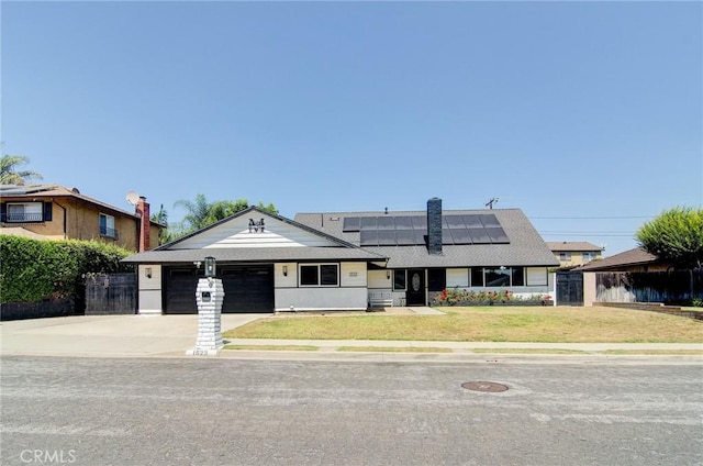 1523 Finegrove Ave, Hacienda Heights, CA 91745 - view of front of house featuring concrete driveway, roof mounted solar panels, and a garage