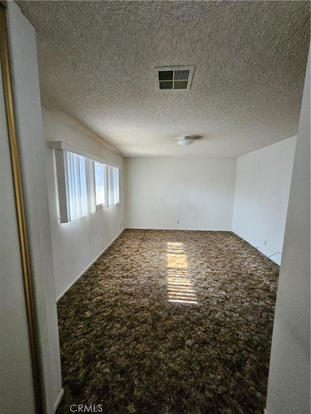 12546 Rain Shadow Rd, Victorville, CA 92395 - unfurnished room featuring carpet flooring and a textured ceiling