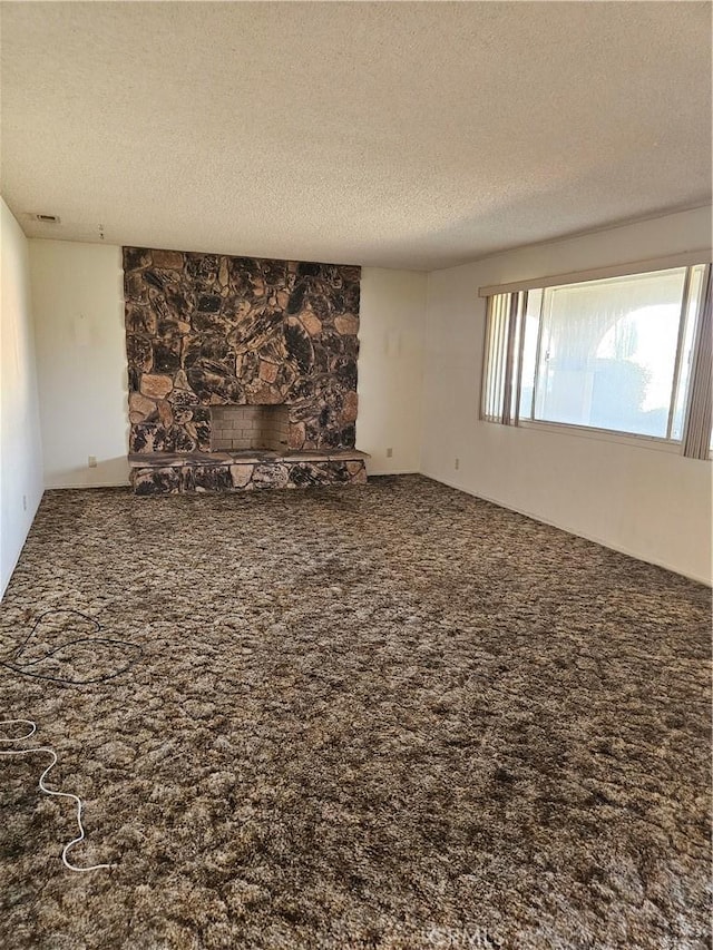 12546 Rain Shadow Rd, Victorville, CA 92395 - carpeted empty room with a textured ceiling