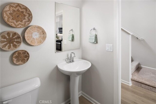 25172 Hunter Ave, Moreno Valley, CA 92551 - half bathroom with wood finished floors and toilet