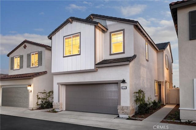 25172 Hunter Ave, Moreno Valley, CA 92551 - view of front of property with an attached garage, stucco siding, concrete driveway, and a tile roof