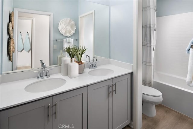25172 Hunter Ave, Moreno Valley, CA 92551 - bathroom with double vanity, wood finished floors, and shower / bathtub combination with curtain