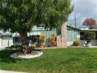 15246 Mystic St, Whittier, CA 90604 - view of front facade featuring a front lawn and an attached garage