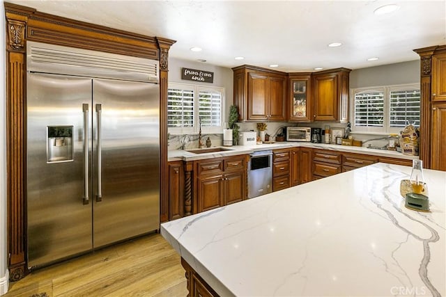 514 Riviera Dr, Lake Arrowhead, CA 92352 - kitchen featuring stainless steel appliances, plenty of natural light, light wood-style flooring, light stone countertops, and recessed lighting