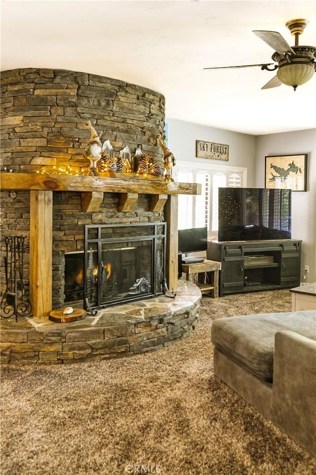 514 Riviera Dr, Lake Arrowhead, CA 92352 - living area with a stone fireplace, a ceiling fan, and carpet floors