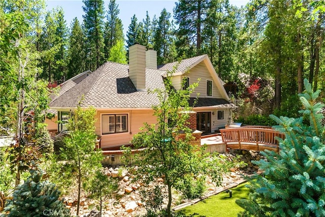 514 Riviera Dr, Lake Arrowhead, CA 92352 - rear view of house featuring a wooden deck, a chimney, and a shingled roof