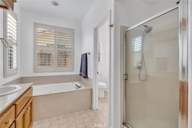 658 Tusky Ave, Los Banos, CA 93635 - full bath featuring plenty of natural light, vanity, a bath, and a stall shower