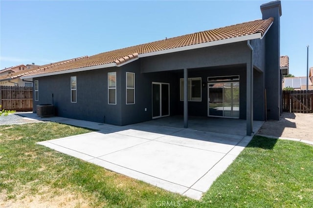 658 Tusky Ave, Los Banos, CA 93635 - rear view of property with a tiled roof, stucco siding, and a patio