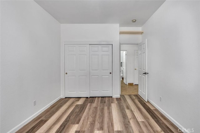 658 Tusky Ave, Los Banos, CA 93635 - unfurnished bedroom featuring wood finished floors and a closet