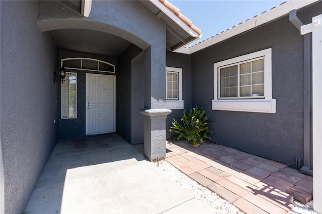 658 Tusky Ave, Los Banos, CA 93635 - doorway to property featuring stucco siding