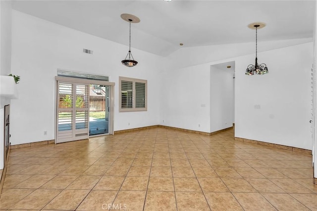 658 Tusky Ave, Los Banos, CA 93635 - unfurnished room featuring lofted ceiling, light tile patterned floors, and a chandelier