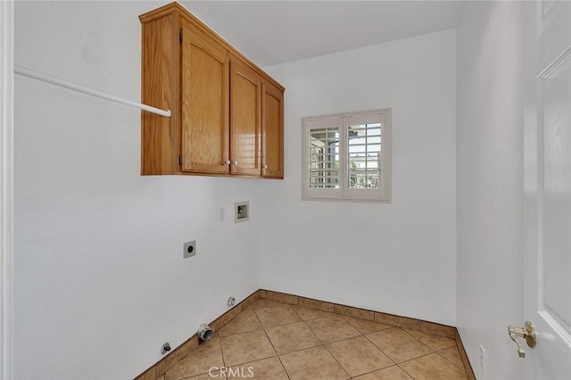 658 Tusky Ave, Los Banos, CA 93635 - laundry room with hookup for a washing machine, gas dryer hookup, electric dryer hookup, light tile patterned floors, and cabinet space