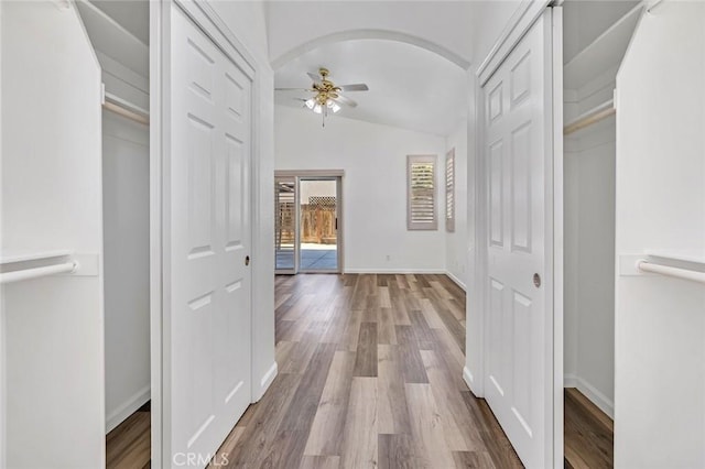 658 Tusky Ave, Los Banos, CA 93635 - hallway with lofted ceiling and wood finished floors