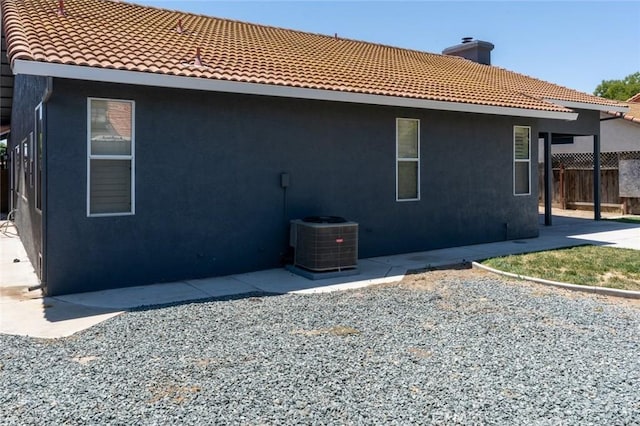 658 Tusky Ave, Los Banos, CA 93635 - rear view of house featuring a tiled roof and stucco siding