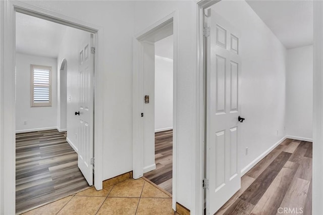 658 Tusky Ave, Los Banos, CA 93635 - hall featuring arched walkways and light wood-style floors