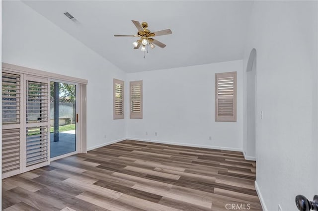 658 Tusky Ave, Los Banos, CA 93635 - spare room with a ceiling fan, wood finished floors, arched walkways, and high vaulted ceiling