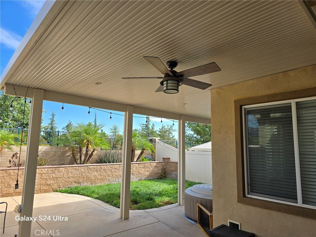 33853 Cansler Way, Yucaipa, CA 92399 - fenced backyard with a patio, a hot tub, and a ceiling fan