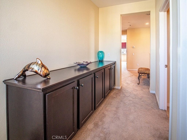 9275 Serenity St, Riverside, CA 92508 - corridor with light colored carpet and baseboards